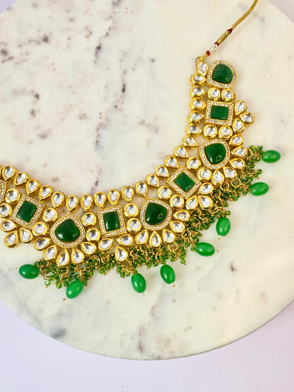 mesmerizing rajasthani  kundan bottle green set