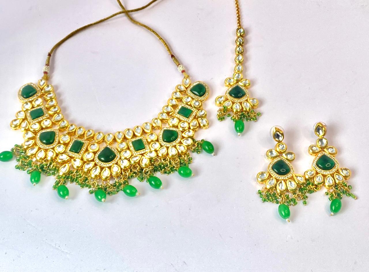 mesmerizing rajasthani  kundan bottle green set